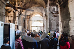 Blurred unfocused picture of tourists in Coliseum. Rome. Italy