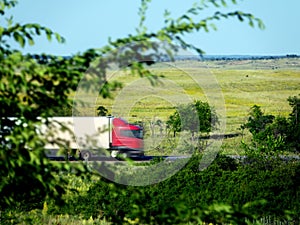 Blurred unrecognizable truck transport on road