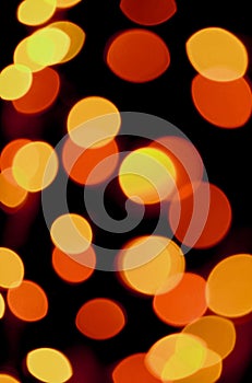 Blurred Vibrant Yellow and Orange Color Illuminated Light on Dark Background