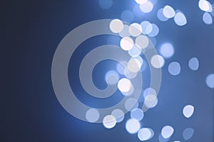 Blurred view of beautiful lights on blue background, space for text