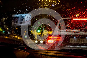 Blurred view through the car`s windshield on the city road