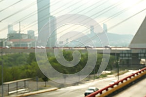 Blurred view of cars on modern bridge photo