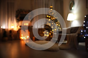 Blurred view of festive interior with Christmas tree