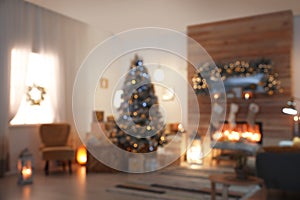 Blurred view of living room interior with Christmas tree