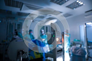 Blurred view of medical team performing surgery