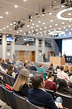 Blurred seminar hall with people photo