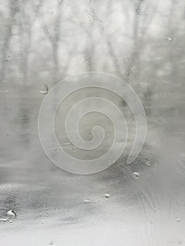 Blurred vision of snowy landscape from train window