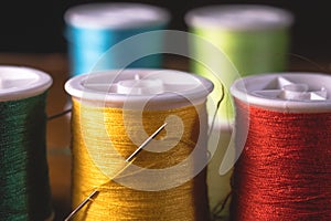 Blurred vivid colors threads bobbins spools, industrial sewing concept design