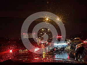Blurred water drops on mirror of car in the raining day.Ã¢â¬â¹