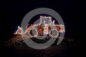 Blurred wheel loader decorated with lights