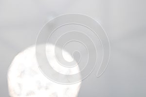 Blurred white background with heavy lights. Modern and abstract background blurred with rounded spherical geometrical shapes. Big photo