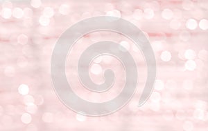 Blurred white sparkle bokeh glitter abstract for light pink background