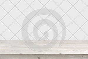 Blurred white tile wall background with wooden planks in front