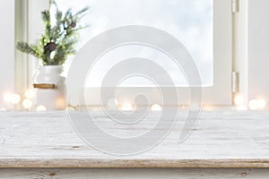 Blurred winter holiday background with vintage wooden table in front