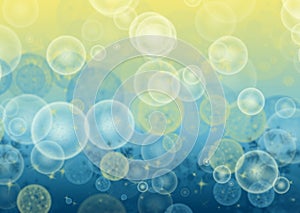 Blurred yellow-blue bokeh background for text, decoration, abstraction with circles, stars, snowflakes, water imitation, bubbles