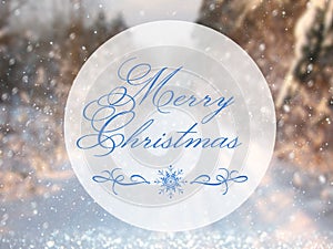 Blurry and abstract magical winter landscape photo with greeting text: Merry Christmas. Glitter overlay.