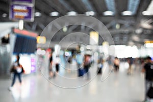 Blurry background of airport with crowd people. Abstract concept