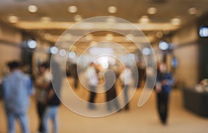 Blurry background of exhibition expo with crowd people in convention hall. Abstract concept. Business marketing and event theme.