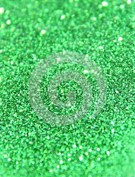 Blurry background of green glitter sparkle