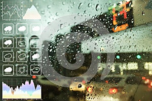 Blurry background image of traffic transportation on rainy day with beautiful bokeh from traffic jam and weather symbol.