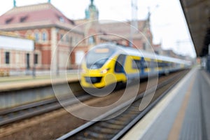 Blurry background image of a train and station. Long-distance train. Touristic concepts.