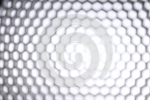 Blurry black honeycomb on white isolated background