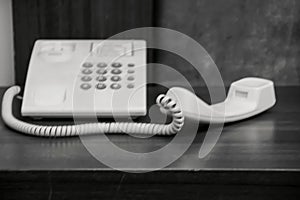 blurry black and white photo, old telephone .