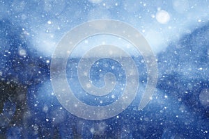 Blurry blue background with snow texture photo