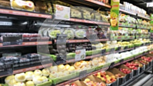 Blurry - Blur image of fresh vegetables and fruits on shelf in supermarket convenience store for background.