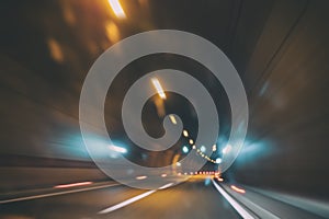 Blurry car tunnel with lights, motion blur background