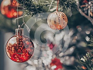 Blurry of Christmas and New Year`s balls with beautiful decorations on the Christmas treedecorations on the Christmas tree, soft l