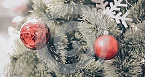 Blurry of Christmas and New Year`s balls with beautiful decorations on the Christmas treedecorations on the Christmas tree, soft l