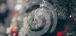 Blurry of Christmas and New Year`s balls with beautiful decorations on the Christmas treedecorations on the Christmas tree, soft l