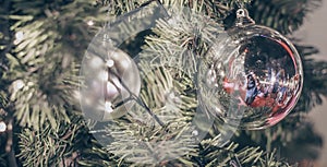 Blurry of Christmas and New Year`s balls with beautiful decorations on the Christmas treedecorations on the Christmas tree, soft l