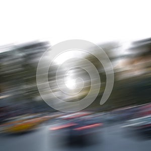 Blurry city background with cars on a road