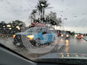 Blurry driver view of road during monsoon rain in Phoenix, AZ