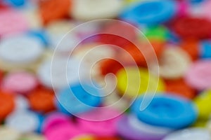 Blurry image of colorful sewing buttons clasper