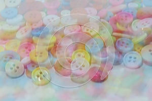 Blurry image of colorful sewing buttons clasper