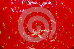 Blurry image of red strawberry texture background. Abstract food texture backdrop.