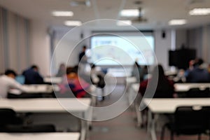 Blurry image of seminar in classroom