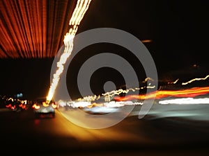 Blurry lights of cars on city streets at night, Light trails from transport - rush hour.