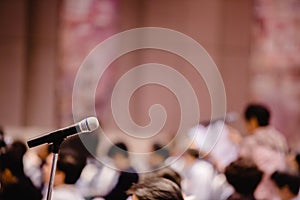 Blurry of microphone in auditorium and projector for shareholders ` meeting