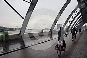 Blurry motion image of people riding a bicycles