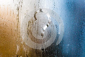 Blurry question mark on foggy condensation window glass natural surface background photo