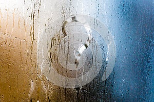 Blurry question mark on foggy condensation window glass natural surface background