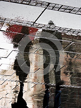 Blurry shadow and silhouette of a young couple under spring rain