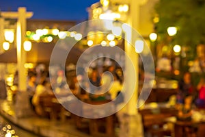 Blurry shot of restaurant at night and light bokeh with people customer.