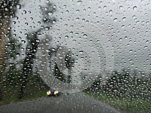 Blurry view of countryside road bad weather.