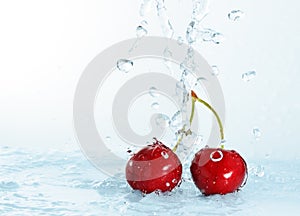 Blurry water being poured on cherries