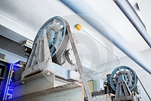 Blurry of wheel rotating with motor driven  with sling cable in control room